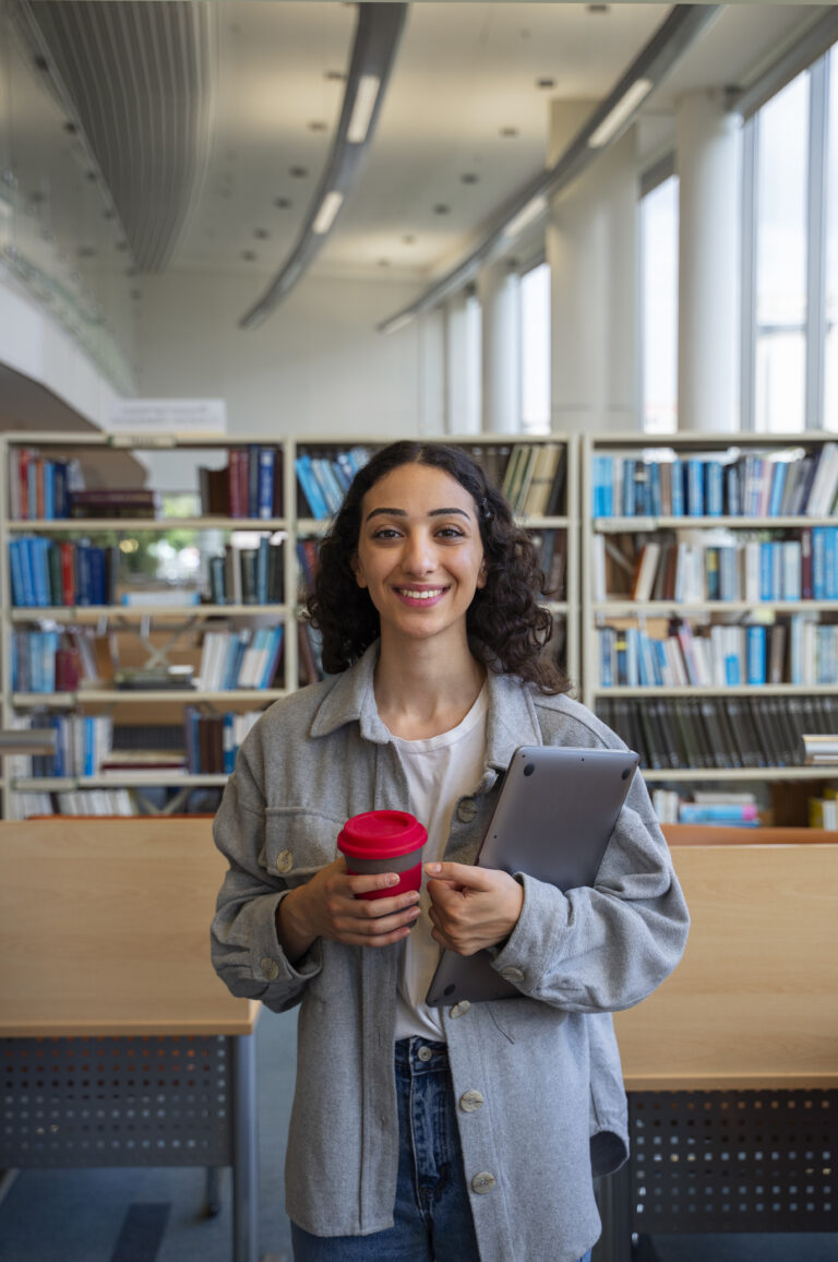 front-view-smiley-student-with-laptop