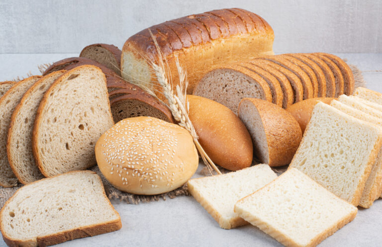 Set of various bread on stone background