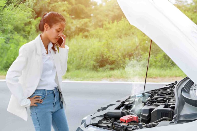 professional towing services near me loading car onto flatbed truck