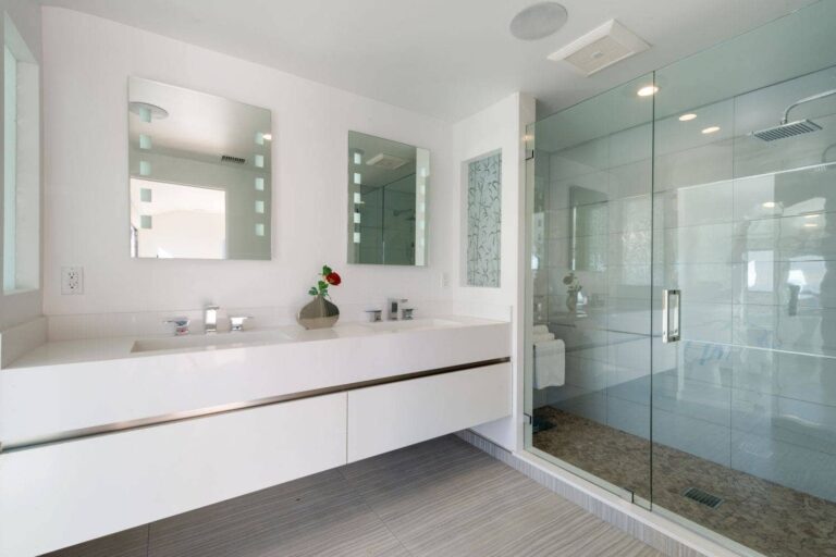 A white floating bathroom vanity with a wide size and double sinks