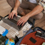 Person using a laptop to plan trips using Google tools