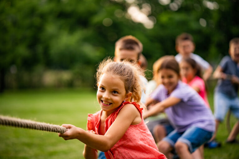 Group of kids pulling a rope