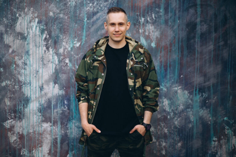 You see military style everywhere right now. It shows up in streetwear, weekend outfits, travel looks, and even casual offices. Cargo pants, field jackets, and graphic tees have become part of daily fashion in the United States. You may like the clean structure and strong message behind this style. It often reflects discipline, strength, and pride. But if you wear too many military pieces at once, your outfit can start to look like a costume. The good news is that you can wear this trend simply and in a balanced way. You just need to focus on control, fit, and purpose. When styled right, military fashion feels natural and modern. Below are practical tips to help you wear military looks without going too far. Tips to Style Military-Inspired Apparel Without Overdoing It Start With One Strong Piece The easiest way to keep your outfit balanced is to choose one military item as the focus. This could be cargo pants, a field jacket, a structured hoodie, or a graphic tee. If you wear cargo pants, pair them with a plain white or black shirt. If you choose a military jacket, wear it with slim jeans and clean sneakers. Let that one piece stand out while the rest of your outfit stays simple. When you limit yourself to one strong item, your look feels intentional. It does not look forced. This simple step helps you stay stylish without overdoing it. Keep Your Colors Simple and Neutral Military style usually comes in olive, tan, black, navy, and camouflage. These colors are easy to mix, but you still need to balance them. If you wear camouflage, keep the rest of your outfit solid. Too many prints can look busy. Pair olive with white. Match black with light denim. Combine tan with soft gray. Neutral colors help your outfit feel clean and modern. They also make your look work in more settings, like casual offices or social events. When you keep the color palette simple, the outfit is easier to wear. Focus on Fit Instead of Bulk Fit can make or break your outfit. Some military pieces are designed with structure, but that does not mean they should look oversized or heavy. Choose cargo pants that fit straight or slim through the leg. Pick jackets that sit well on your shoulders. Avoid hoodies that are too long or too baggy. Modern Military inspired apparel is more about clean lines than heavy layers. When your clothes fit well, you look sharp and put together. You do not need extra bulk to make a statement. Mix Military Pieces With Everyday Basics You do not need a full military look from head to toe. Instead, mix one military piece with clothes you already wear. Try simple combos like: A military jacket with blue jeans A tactical-style hoodie with joggers A graphic tee with clean sneakers This keeps your outfit balanced and easy to wear. Most people want Military inspired apparel that fits daily life, not just special occasions. When you mix utility pieces with basics, your style feels natural and confident. Keep Accessories Minimal Accessories can quickly push your outfit too far. Heavy chains, too many patches, or large tactical bags can overpower your look. Stick to simple accessories instead. A clean watch, neutral sneakers, or a basic belt work well. If your shirt or jacket already has a strong design, let it stand on its own. Less detail often creates a stronger result. When you keep accessories minimal, your outfit stays focused and balanced. Choose Graphics With Meaning Graphic tees and hoodies are important in military fashion, but not every design works well. Choose artwork that reflects your values or lifestyle, such as patriotism or outdoor culture. Avoid graphics that look crowded or hard to read. A clean design makes your outfit feel personal. Military-inspired apparel stands out because it blends message and style in a simple way. When your clothing tells a clear story, it feels real and easy to wear. Dress for the Occasion Think about where you are going. Military style works best in casual settings, but context matters. For weekends, wear cargo pants with sneakers. For dinner, pair a field jacket with dark denim and boots. For travel, choose a structured hoodie with joggers for comfort. Avoid heavy pieces at formal events. Match your outfit to the setting so your style feels natural and appropriate. Bottom Line Military fashion continues to influence modern American style because it blends structure with everyday wear. You can enjoy this trend without going overboard if you focus on balance. Start with one strong piece. Keep your colors neutral. Make sure the fit is clean. Mix military items with simple basics. Limit your accessories. Choose graphics that mean something to you. Always dress for the setting. When you follow these steps, your outfit feels controlled and confident. You show personality without looking like you are wearing a uniform. Brands like Slaptail Industries & Apparel understand this approach. They focus on graphic-driven designs that reflect military influence while still fitting into daily life. When you choose pieces that match your lifestyle, you create a look that feels true to you. Military style works best when it feels natural. Keep it simple, stay balanced, and wear it your way.