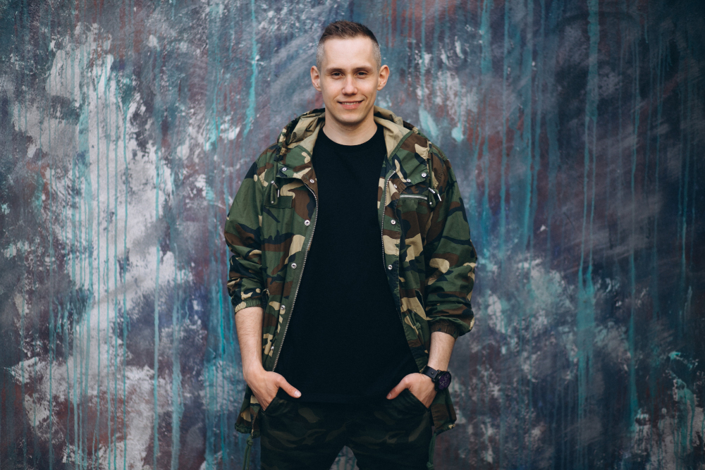 You see military style everywhere right now. It shows up in streetwear, weekend outfits, travel looks, and even casual offices. Cargo pants, field jackets, and graphic tees have become part of daily fashion in the United States. You may like the clean structure and strong message behind this style. It often reflects discipline, strength, and pride. But if you wear too many military pieces at once, your outfit can start to look like a costume. The good news is that you can wear this trend simply and in a balanced way. You just need to focus on control, fit, and purpose. When styled right, military fashion feels natural and modern. Below are practical tips to help you wear military looks without going too far. Tips to Style Military-Inspired Apparel Without Overdoing It Start With One Strong Piece The easiest way to keep your outfit balanced is to choose one military item as the focus. This could be cargo pants, a field jacket, a structured hoodie, or a graphic tee. If you wear cargo pants, pair them with a plain white or black shirt. If you choose a military jacket, wear it with slim jeans and clean sneakers. Let that one piece stand out while the rest of your outfit stays simple. When you limit yourself to one strong item, your look feels intentional. It does not look forced. This simple step helps you stay stylish without overdoing it. Keep Your Colors Simple and Neutral Military style usually comes in olive, tan, black, navy, and camouflage. These colors are easy to mix, but you still need to balance them. If you wear camouflage, keep the rest of your outfit solid. Too many prints can look busy. Pair olive with white. Match black with light denim. Combine tan with soft gray. Neutral colors help your outfit feel clean and modern. They also make your look work in more settings, like casual offices or social events. When you keep the color palette simple, the outfit is easier to wear. Focus on Fit Instead of Bulk Fit can make or break your outfit. Some military pieces are designed with structure, but that does not mean they should look oversized or heavy. Choose cargo pants that fit straight or slim through the leg. Pick jackets that sit well on your shoulders. Avoid hoodies that are too long or too baggy. Modern Military inspired apparel is more about clean lines than heavy layers. When your clothes fit well, you look sharp and put together. You do not need extra bulk to make a statement. Mix Military Pieces With Everyday Basics You do not need a full military look from head to toe. Instead, mix one military piece with clothes you already wear. Try simple combos like: A military jacket with blue jeans A tactical-style hoodie with joggers A graphic tee with clean sneakers This keeps your outfit balanced and easy to wear. Most people want Military inspired apparel that fits daily life, not just special occasions. When you mix utility pieces with basics, your style feels natural and confident. Keep Accessories Minimal Accessories can quickly push your outfit too far. Heavy chains, too many patches, or large tactical bags can overpower your look. Stick to simple accessories instead. A clean watch, neutral sneakers, or a basic belt work well. If your shirt or jacket already has a strong design, let it stand on its own. Less detail often creates a stronger result. When you keep accessories minimal, your outfit stays focused and balanced. Choose Graphics With Meaning Graphic tees and hoodies are important in military fashion, but not every design works well. Choose artwork that reflects your values or lifestyle, such as patriotism or outdoor culture. Avoid graphics that look crowded or hard to read. A clean design makes your outfit feel personal. Military-inspired apparel stands out because it blends message and style in a simple way. When your clothing tells a clear story, it feels real and easy to wear. Dress for the Occasion Think about where you are going. Military style works best in casual settings, but context matters. For weekends, wear cargo pants with sneakers. For dinner, pair a field jacket with dark denim and boots. For travel, choose a structured hoodie with joggers for comfort. Avoid heavy pieces at formal events. Match your outfit to the setting so your style feels natural and appropriate. Bottom Line Military fashion continues to influence modern American style because it blends structure with everyday wear. You can enjoy this trend without going overboard if you focus on balance. Start with one strong piece. Keep your colors neutral. Make sure the fit is clean. Mix military items with simple basics. Limit your accessories. Choose graphics that mean something to you. Always dress for the setting. When you follow these steps, your outfit feels controlled and confident. You show personality without looking like you are wearing a uniform. Brands like Slaptail Industries & Apparel understand this approach. They focus on graphic-driven designs that reflect military influence while still fitting into daily life. When you choose pieces that match your lifestyle, you create a look that feels true to you. Military style works best when it feels natural. Keep it simple, stay balanced, and wear it your way.